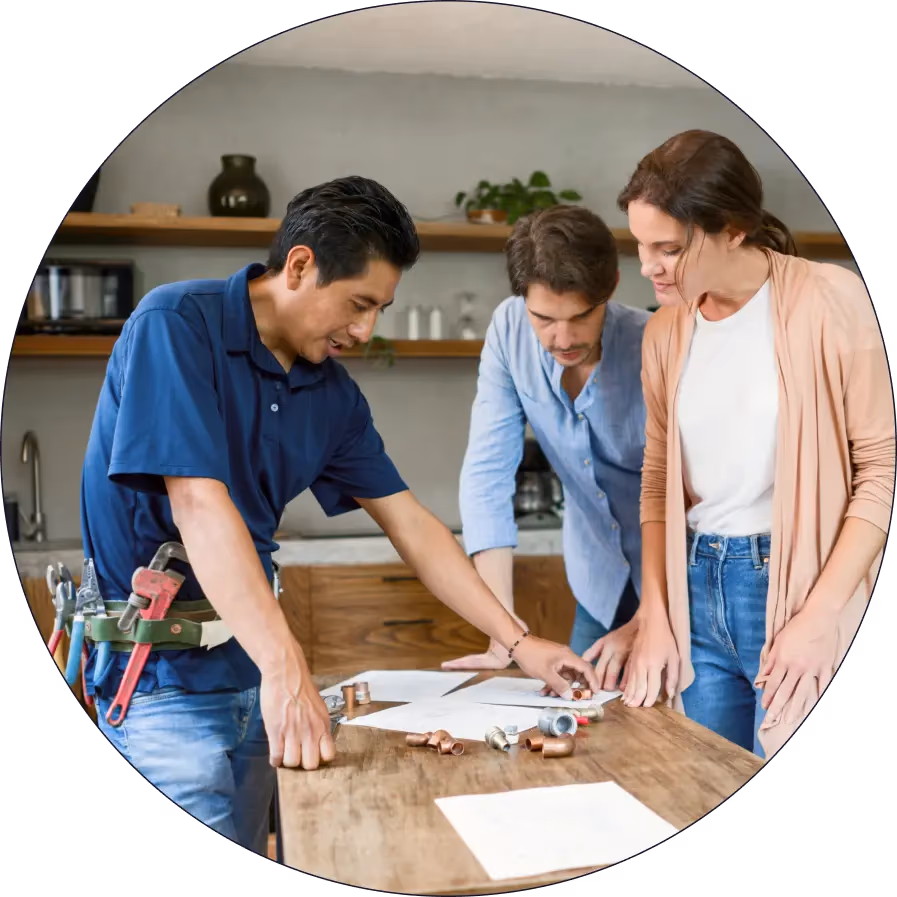 The Handyman Company craftsmen planning a job with a customer
