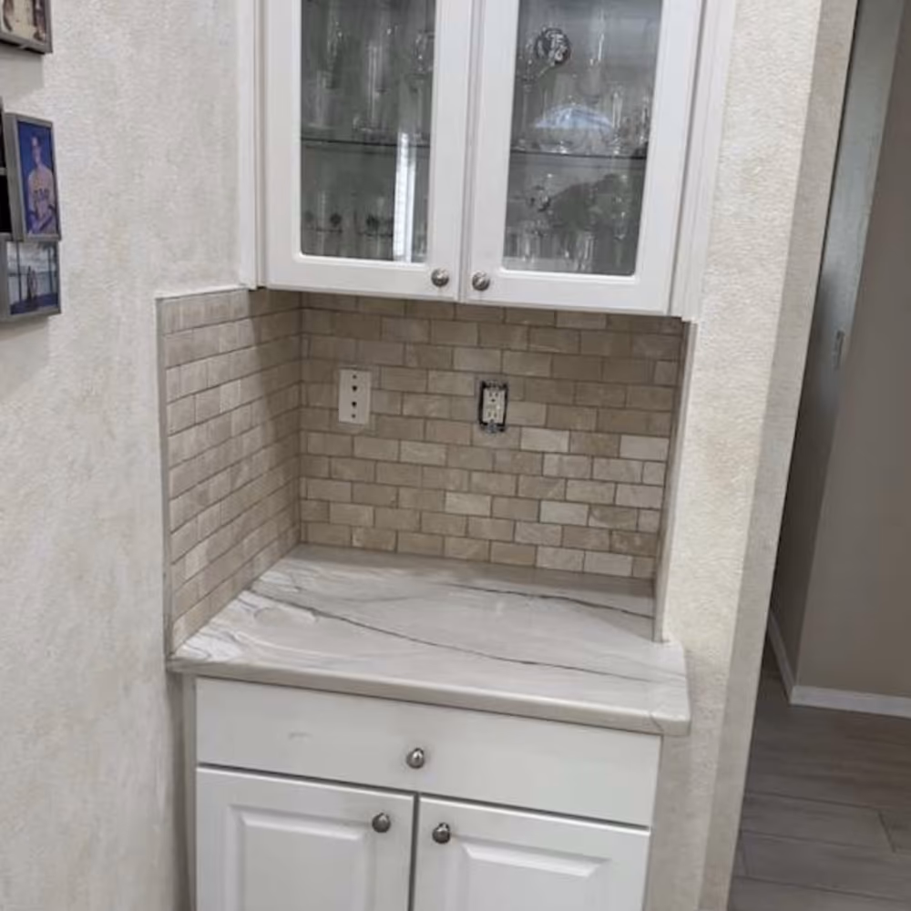 Finished kitchen nook with rebuilt wall and new backsplash