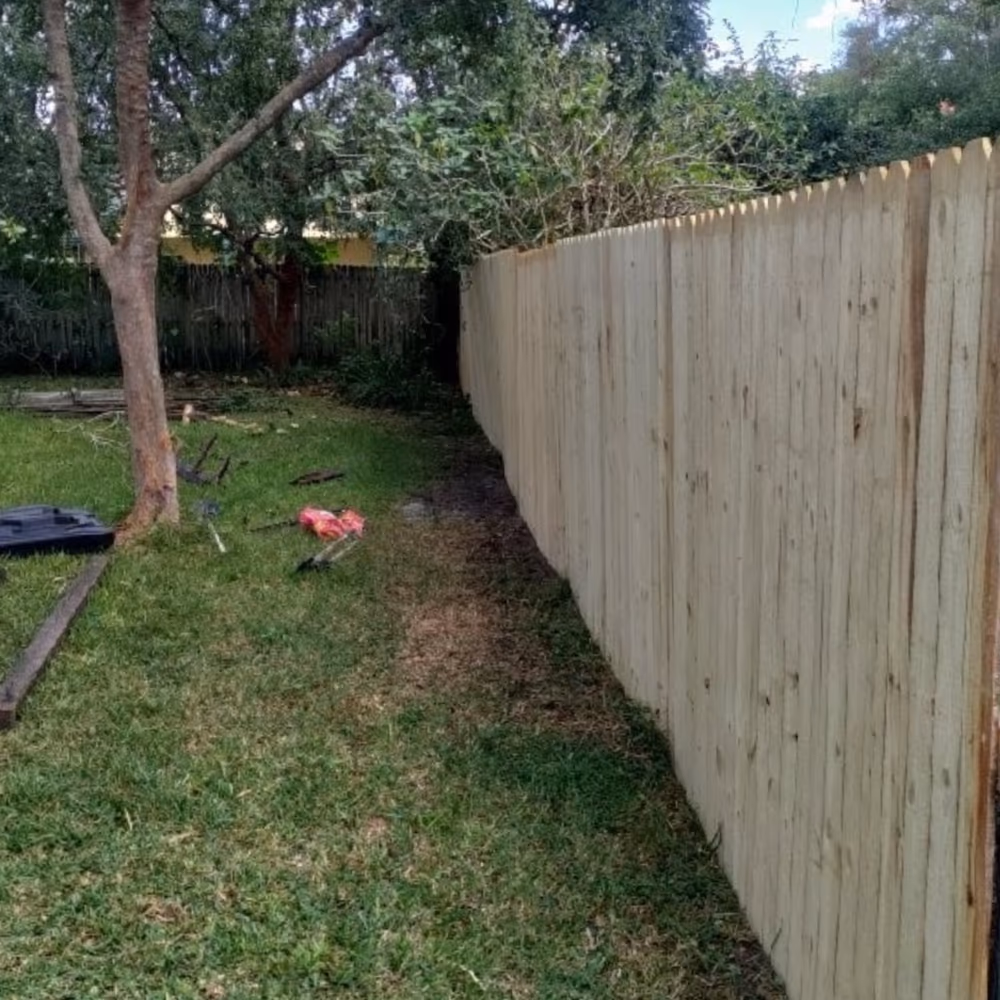 New wood fence installed straight and solid