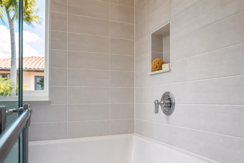 Close view of a flawlessly finished Florida shower with matched tile, crisp new grout lines, and clean mildew-resistant caulk at the corners