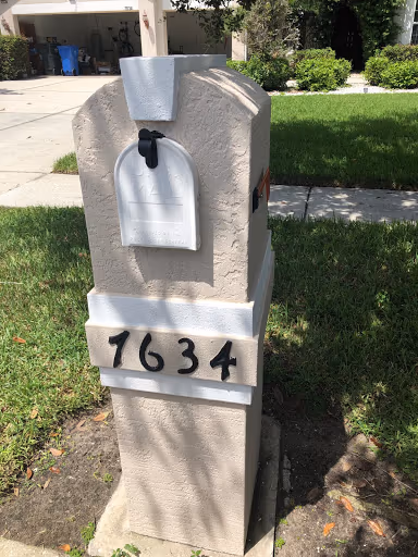 Stucco mailbox pillar rebuilt and refinished with new paint and numbers