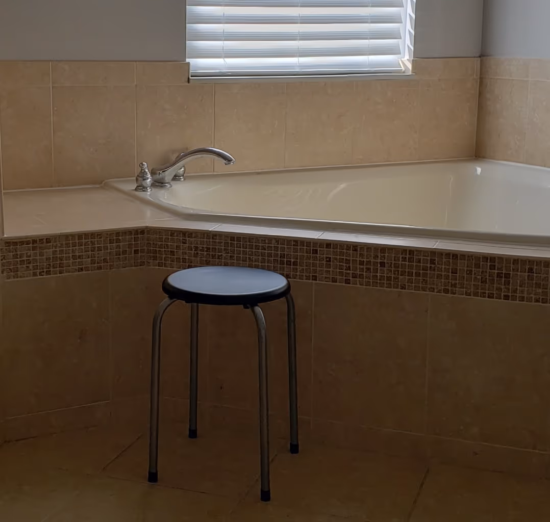 Dated built-in corner garden tub before the remodel
